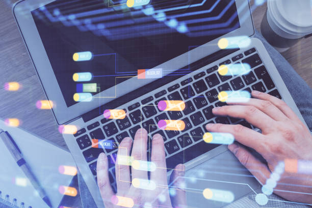 istock Multi exposure of man's hands typing over computer keyboard and data theme hologram drawing. Top view. Technology concept. 1282202940