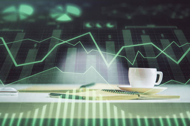 istock Multi exposure of forex graph drawing and desktop with coffee and items on table background. Concept of financial market trading 1282202970