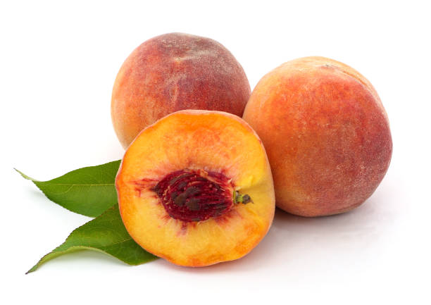 istock Sliced peach and leaves. 1282203055