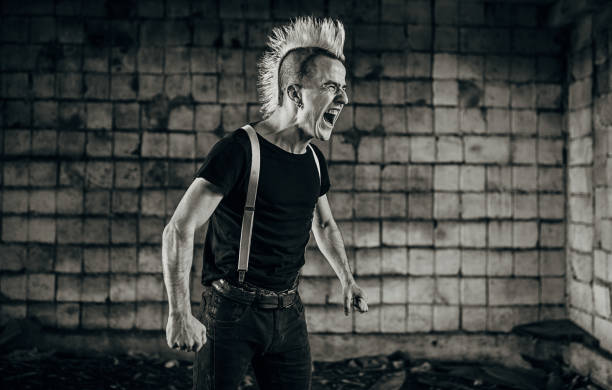 istock One angry young panker screaming in abandoned warehouse 1282203822