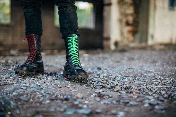 istock Male in combat boots standing in abandoned building 1282205160