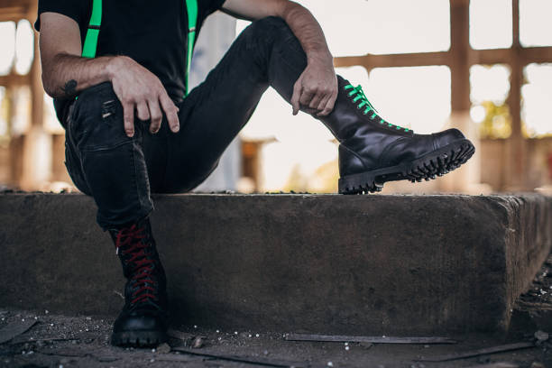 istock Male in combat boots sitting in abandoned building 1282205193