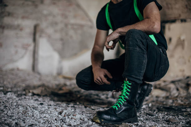 istock Male in combat boots in abandoned building 1282205237