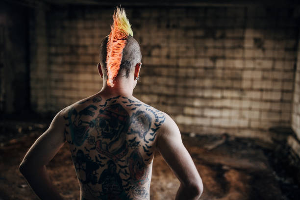 istock Rear view of one young panker with tattoos on back 1282207106