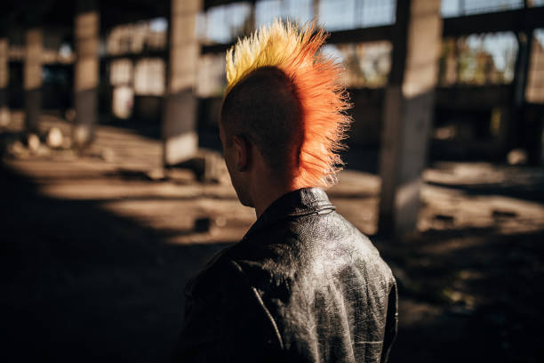 istock One pank person with colorful coiffure walking in abandoned warehouse 1282207176