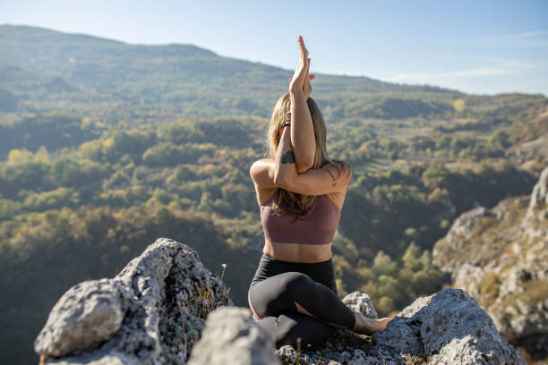 istock Woman stretching her body in nature 1282208844