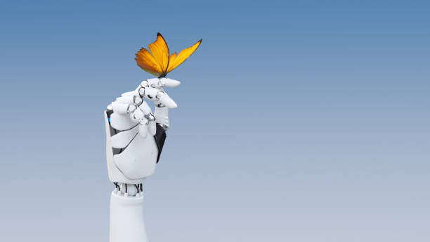 Gentle robot hand A yellow butterfly poised on a robot finger industrial robot stock pictures, royalty-free photos & images