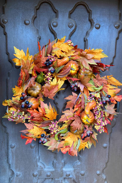 istock New Mexico: Sunlit Autumn Wreath on Old Brown Door 1282211606