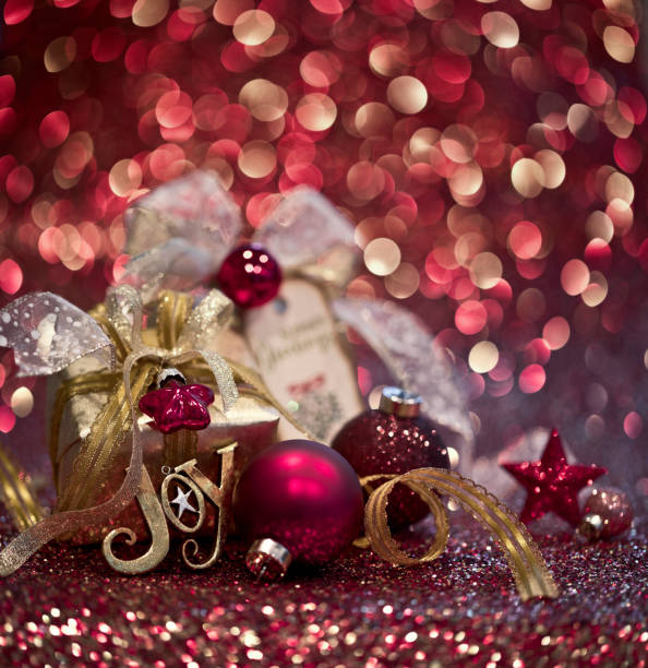 istock Christmas Gift and Red Baubles on a Red Background 1282213190