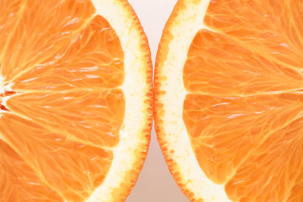 cut half of a fresh juicy textured orange, macro background