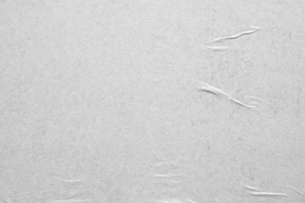 istock Blank white crumpled and creased paper poster texture background 1282215255