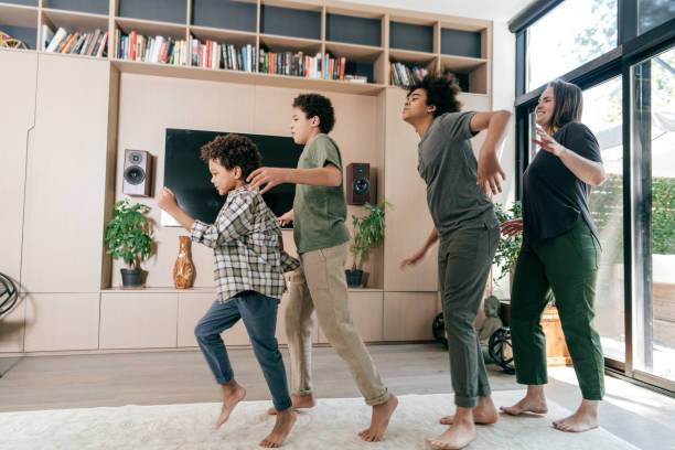 istock Family having great time at home and dancing together 1282215335