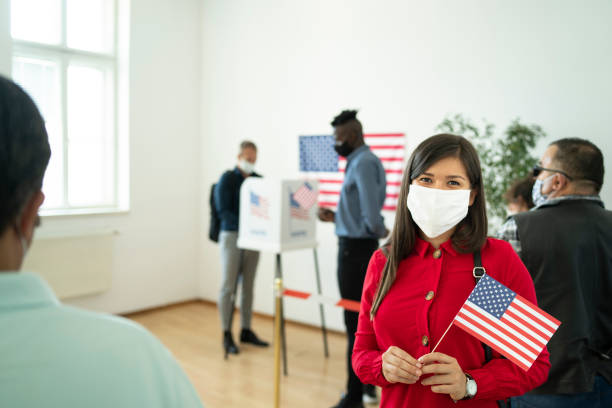 istock A young woman in a polling queue 1282215888