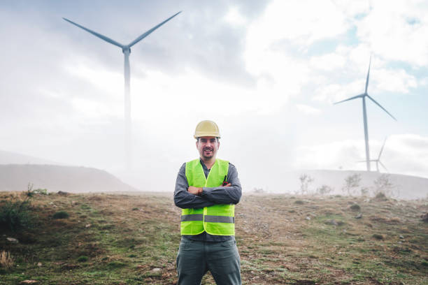 istock Portrait of young engineer man looking and checking wind turbines 1282216905