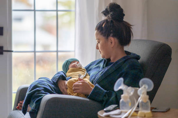 istock Tired new mother holding her baby 1282217918