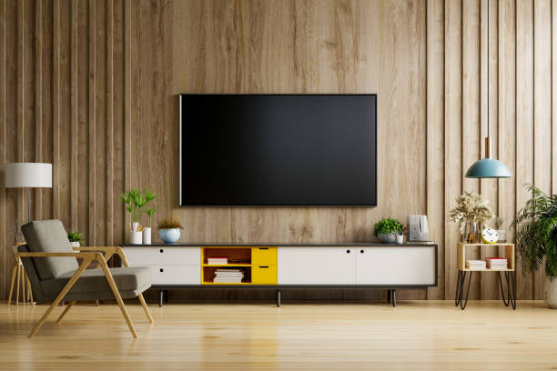 TV on cabinet in modern living room TV on cabinet in modern living room with lamp,table,flower and plant on wooden wall background,3d rendering smart tv stock pictures, royalty-free photos & images