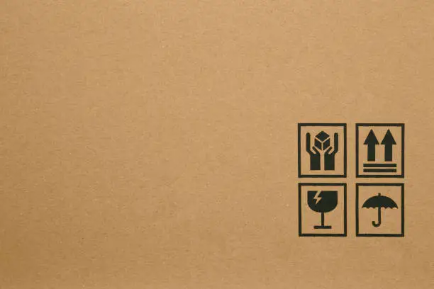 Black fragile symbol on cardboard box