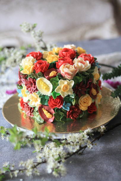 istock Rainbow Buttercream Flower Cake - 2 1282220629