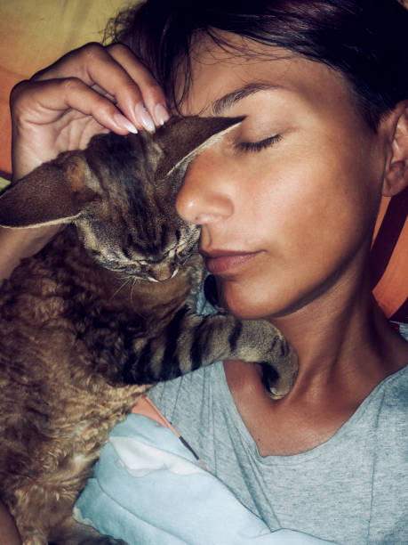 Woman and her Cat portrait in bed