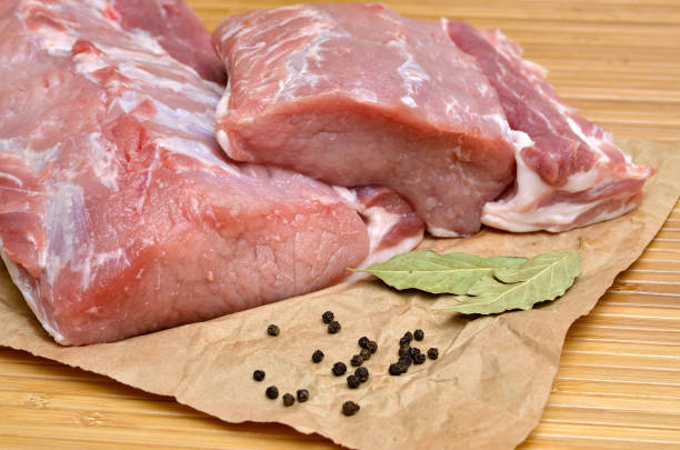 istock A piece of raw meat on a cutting kitchen table 1282222483