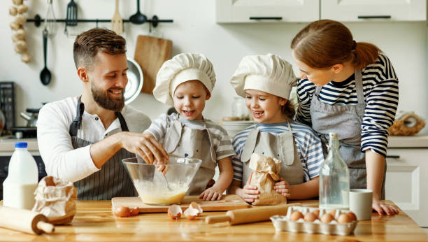istock Positive family preparing pastry together 1282222552