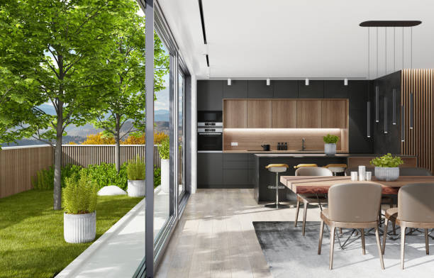 istock Country modern villa with garden. Matte black kitchen interior with island table and dining table. 1282227146