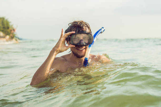 istock A man with a mask and snorkel is going to dive into the sea 1282227262