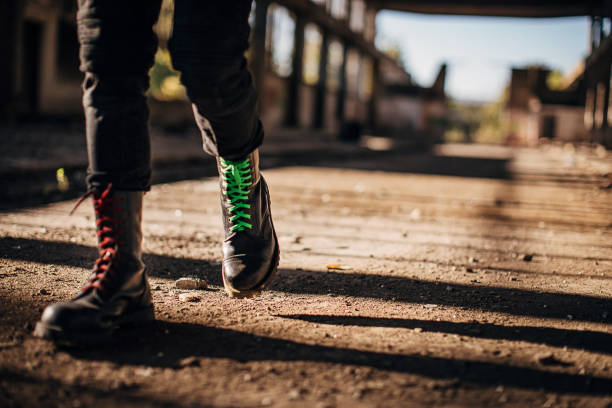 istock Male in combat boots walking in abandoned building 1282228278