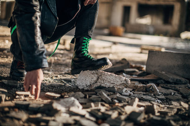 istock Male in combat boots in abandoned building 1282228944