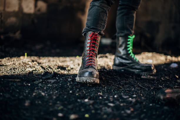 istock Male in combat boots standing in abandoned building 1282228964