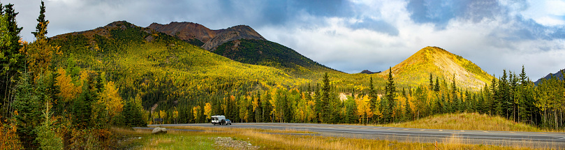 Scenic view of Camper RV driving at Denali National park road of Alaska
