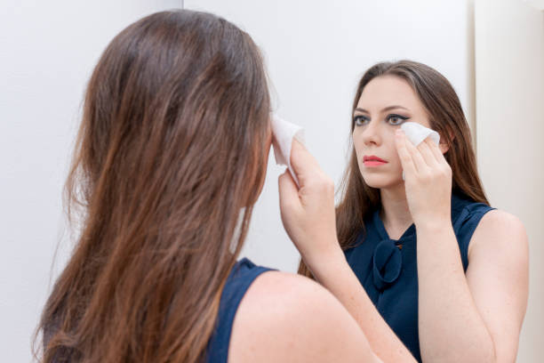 istock Woman with cloth for makeup removal 1282231043