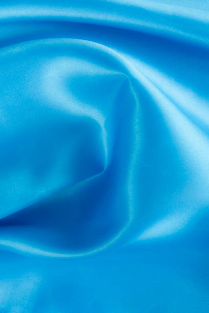 istock Blue satin, fabric and silk texture or background 1282233490