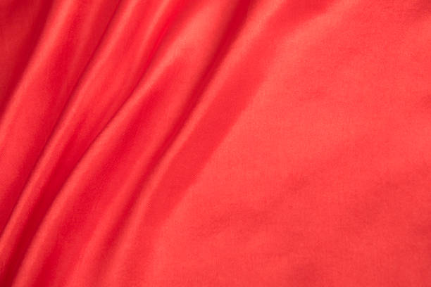 istock red satin, fabric and silk texture or background 1282233528
