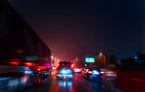istock Heavy traffic on Miami at night during a storm 1282236933