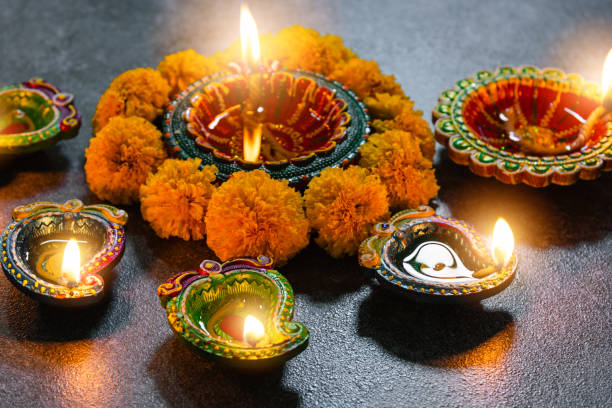 istock Diya or oil lamp with flowers 1282237012