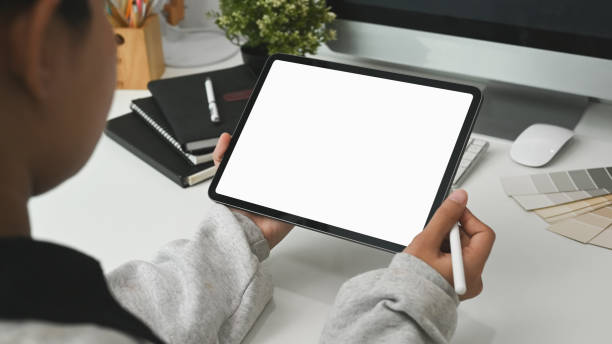 istock Cropped shot of female designer working with mock up tablet at her work space. 1282237030