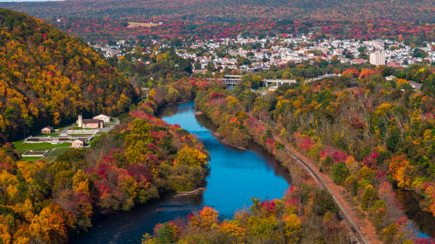 Colorful fall in Appalachian Mountains, Pennsylvania. The aerial remote view on Lehighton along with the Lehigh River. The aerial view of the small town Parriville nearby Lehigh River, Pennsylvania, in fall. pennsylvania stock pictures, royalty-free photos & images