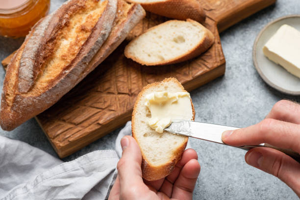 istock Smear butter on baguette bread 1282244287