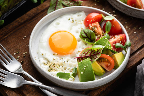 Healthy breakfast food egg and tomato avocado salad