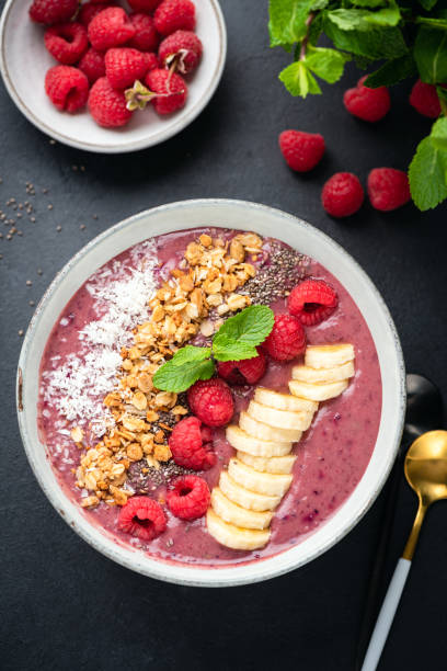 istock Vegan raspberry smoothie bowl with superfood toppings 1282244366