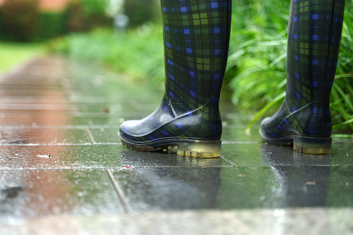 Rubber boots at the rain day, close up, blurring background