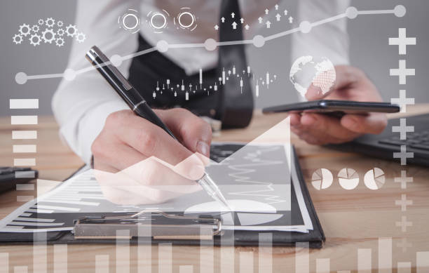 istock Man using smartphone. Working with a business graphs. Growth. Business. Success 1282248525