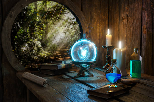 istock Spell book, Crystal mystic light ball, magic ring, magic potions bottles, burning candle and other various witchcraft accessories on the wizard table background. Alchemist  concept. 1282250629