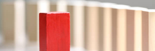 istock Wooden block stands on background vertical bars 1282251963