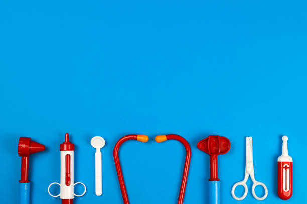 istock toy medical doctor's tools on a blue background. Space for text 1282254919