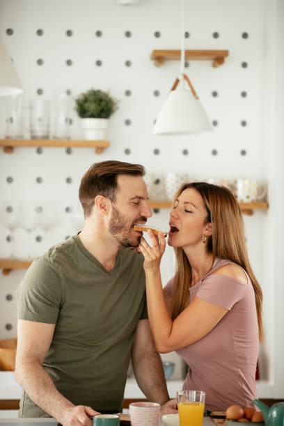 istock Young couple making sandwich at home. 1282255983