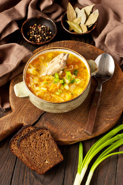 istock Vegetables soup with cabbage in bowl on wooden table 1282256726