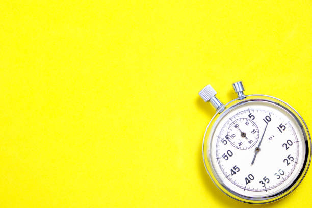 istock Mechanical stopwatch on a yellow background. 1282256745