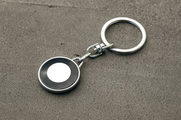 istock Metal key pendant on dark concrete background 1282257045